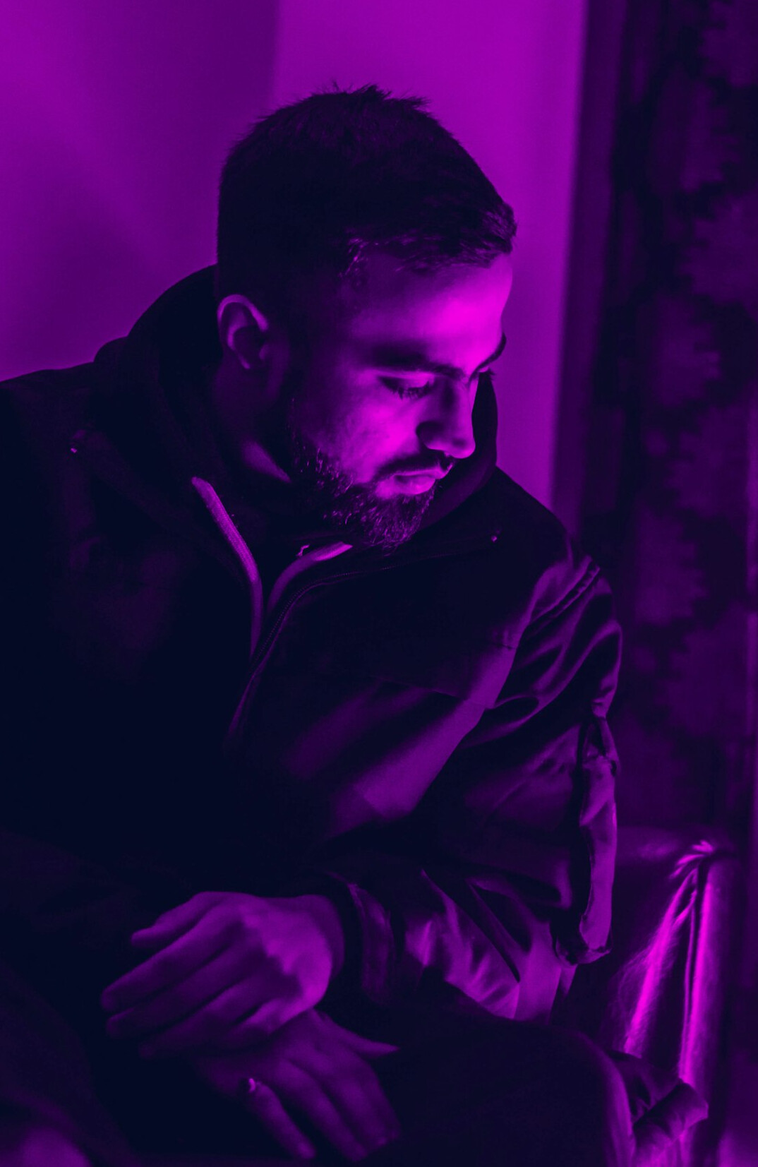 Portrait of a bearded man in a dark jacket
